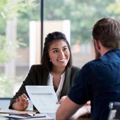Financial advisor meets with a client in the office