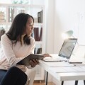 Businesswoman using laptop