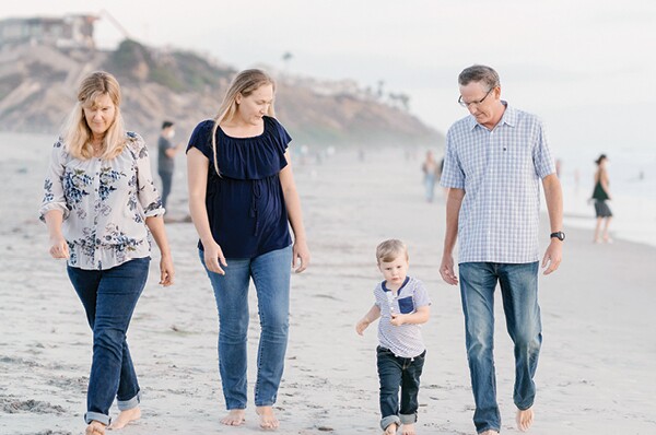 The Bird family walking on beach