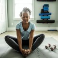 Senior woman exercising in home gym