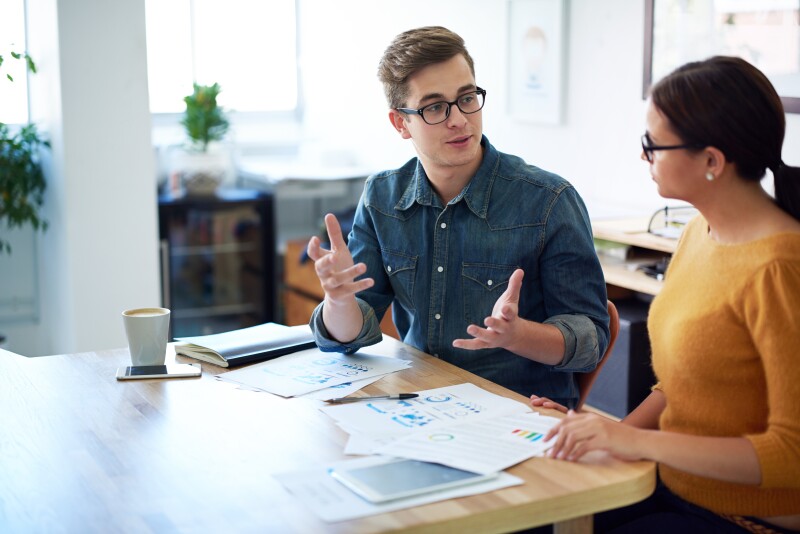 Cropped shot of a man and a woman having a discussion in an office