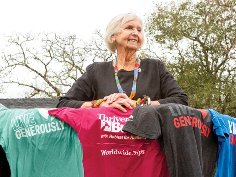 A woman stands on her deck.