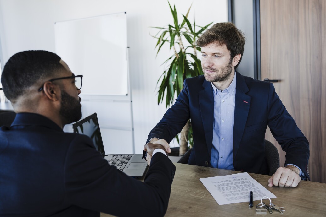 Businessman shaking hand with client