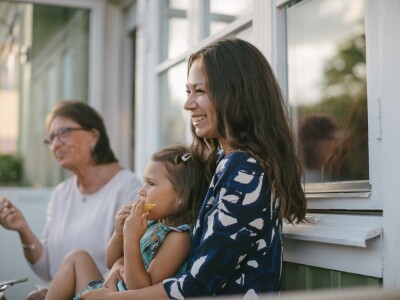 Child on a smiling woman's lap