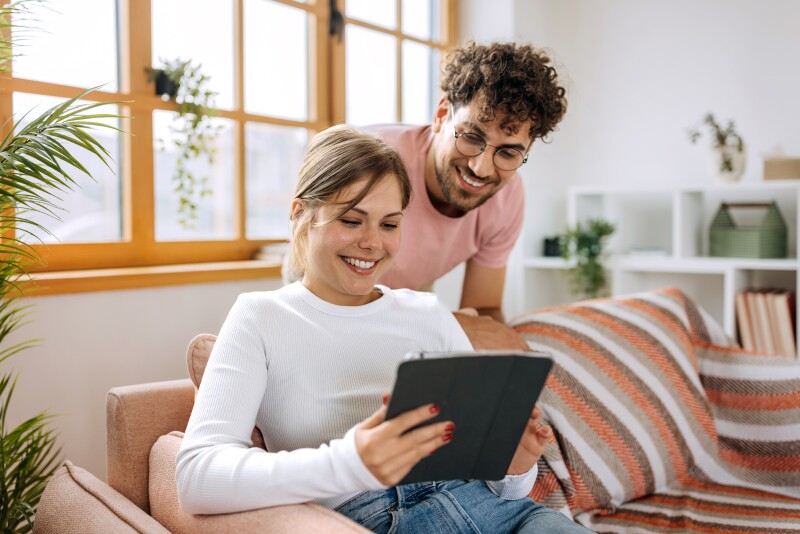 A couple enjoying some content in the tablet