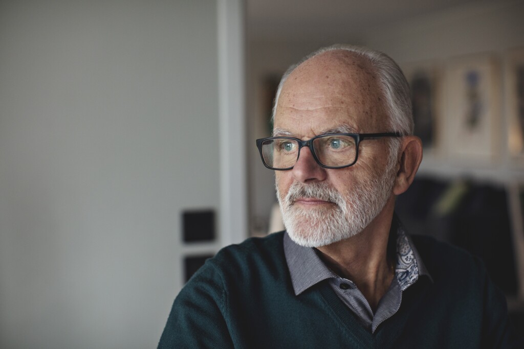 Contemplating senior man in glasses