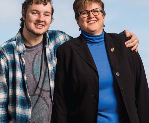 Son with his arm around his mom's shoulder