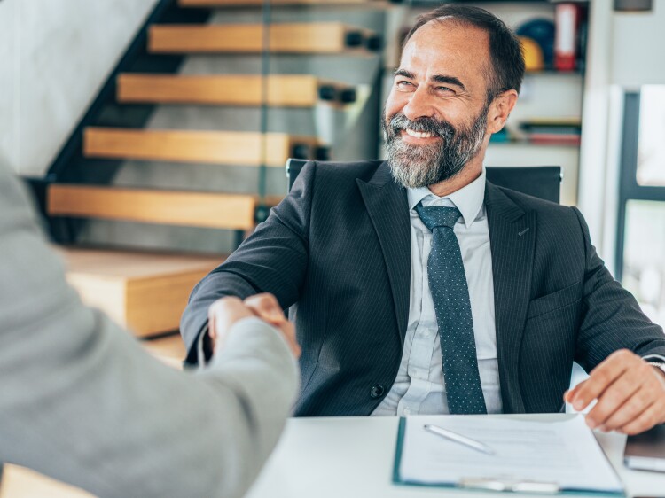 Businessmen shaking hands in the office.
