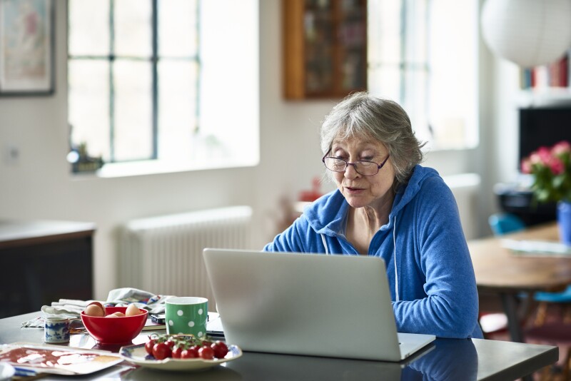 Senior woman looking at laptop