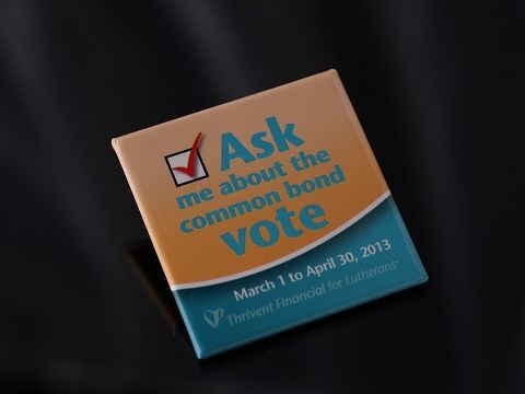 Photo of a pin that says "Ask me about the common bond vote"